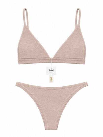 Keen Bralette and Keen Bottom lingerie set in nude beige, featuring a triangle bralette with thin straps and a matching thong on a white background.